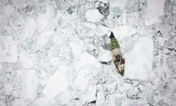 US Navy predicts summer ice free Arctic by 2016 Greenpeace icebreaking ship, Arctic Sunrise, among broken floes of Arctic sea ice, photographed from the air. This image was taken in the Fram Strait. Good to see Greenpeace doing their bit to create more open water.